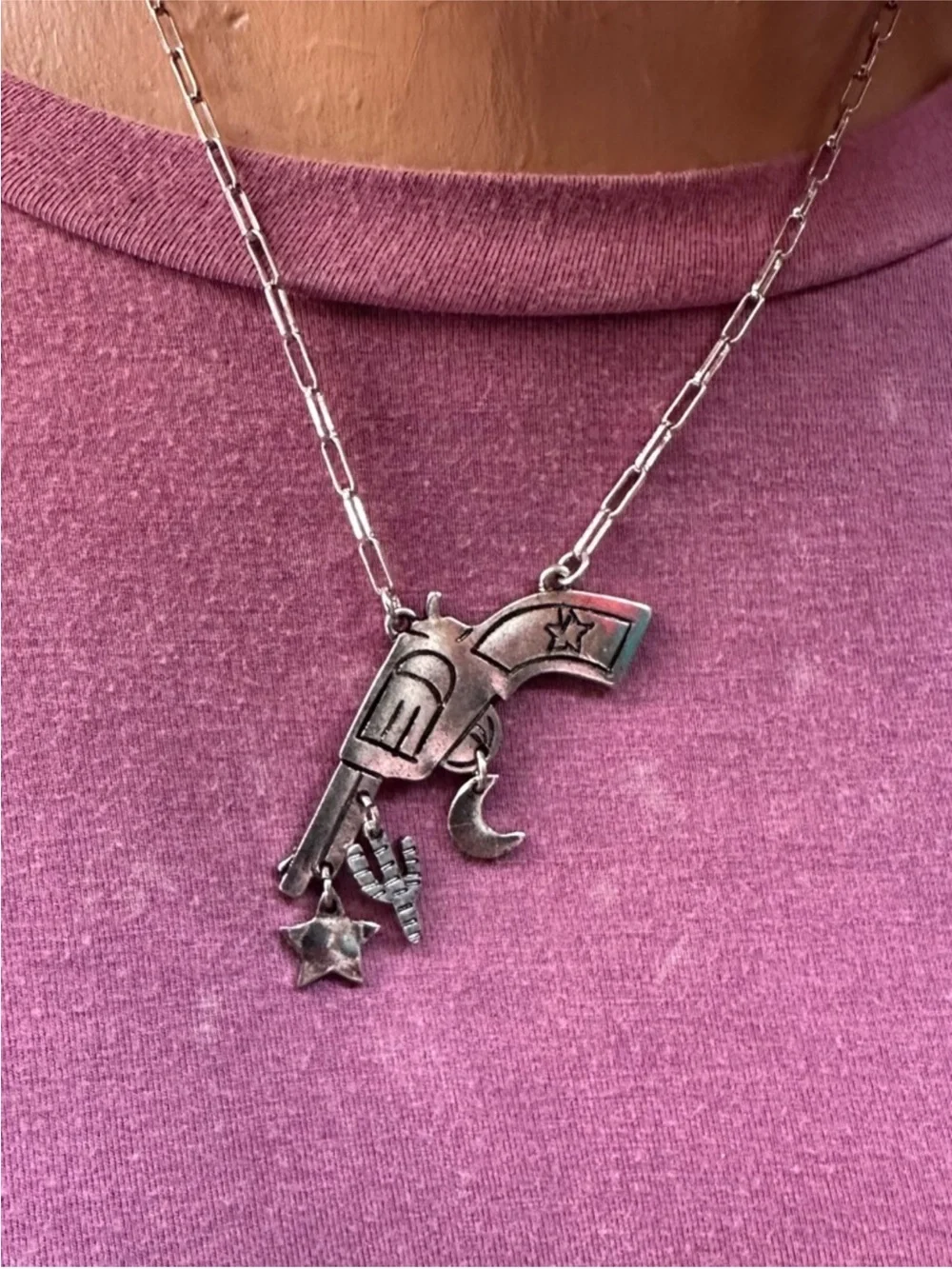 Silver revolver necklace